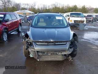 2015 Ford Escape Titanium with VIN 1FMCU0J92FUB74972, listed as a IAAI auction lot 41164519 with 228,785 mi miles and . Bid and sale history available at DreamBid. Image 12.