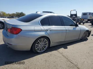 2014 BMW 3 Series 335i xDrive with VIN WBA3B9G57ENR91797, listed as a Copart auction lot 53724325 with 164,279 mi miles and Salvage Title. Bid and sale history available at DreamBid. Image 3.