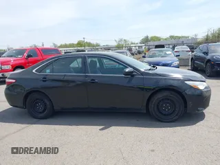 2015 Toyota Camry LE with VIN 4T1BD1FKXFU164963, listed as a IAAI auction lot 42132724 with 141,089 mi miles and . Bid and sale history available at DreamBid. Image 13.