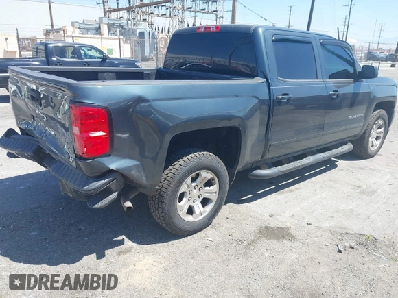 2018 Chevrolet Silverado 1500 LT with VIN 3GCUKREC1JG511846, listed as a IAAI auction lot 42024170 with 121,532 mi miles and . Bid and sale history available at DreamBid. Image 4.