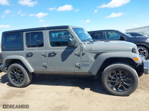 2023 Jeep Wrangler 4xe Sahara with VIN 1C4JJXP62PW696002, listed as a IAAI auction lot 41891127 with 44,567 mi miles. Bid and sale history available at carsss.com. Image 13.