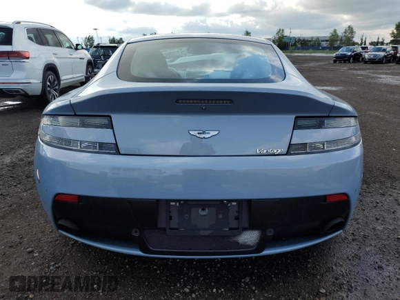 2015 Aston Martin Vantage z VIN SCFEKBAK2FGC19462, wystawiony jako Copart lot #61093934 z przebiegiem 53 068 mil mil oraz Szkoda całkowita • Salvage title. Historia ofert i sprzedaży dostępna na DreamBid. Obrazek 6.