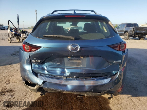 2019 Mazda CX-5 Sport with VIN JM3KFABM5K0676032, listed as a Copart auction lot 52067605 with 59,574 mi miles and Salvage Title. Bid and sale history available at DreamBid. Image 6.