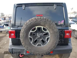 2020 Jeep Wrangler Unlimited Rubicon with VIN 1C4HJXFG1LW141335, listed as a IAAI auction lot 42724973 with 59,843 mi miles and . Bid and sale history available at DreamBid. Image 16.