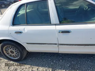 2004 Mercury Grand Marquis GS z VIN 2MEFM74W74X654151, wystawiony jako IAAI lot #42185493 z przebiegiem 203 017 mil mil oraz . Historia ofert i sprzedaży dostępna na DreamBid. Obrazek 11.