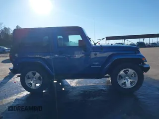 2009 Jeep Wrangler Sahara z VIN 1J4FA54199L722192, wystawiony jako IAAI lot #41619305 z przebiegiem 105 545 mil mil oraz . Historia ofert i sprzedaży dostępna na DreamBid. Obrazek 13.