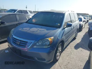 2009 Honda Odyssey EX-L with VIN 5FNRL38759B001130, listed as a IAAI auction lot 42004710 with 142,126 mi miles and . Bid and sale history available at DreamBid. Image 2.