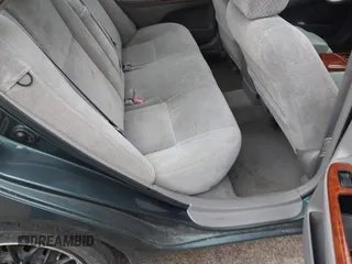 2003 Toyota Camry LE z VIN 4T1BE30K13U746690, wystawiony jako IAAI lot #42220794 z przebiegiem 165 807 mil mil oraz . Historia ofert i sprzedaży dostępna na DreamBid. Obrazek 8.