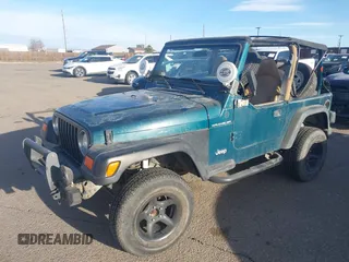 1997 Jeep Wrangler SE with VIN 1J4FY29PXVP409498, listed as a IAAI auction lot 41818698 with 150,086 mi miles. Bid and sale history available at carsss.com. Image 2.