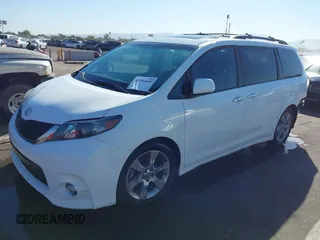 2014 Toyota Sienna SE with VIN 5TDXK3DCXES427950, listed as a IAAI auction lot 40394109 with 149,419 mi miles. Bid and sale history available at carsss.com. Image 2.