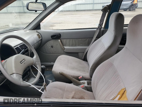 1993 Suzuki Swift z VIN 2S2AC35S5P6601869, wystawiony jako Copart lot #44993725 z przebiegiem 166 429 mil mil oraz Szkody całkowita. Historia ofert i sprzedaży dostępna na DreamBid. Obrazek 7.
