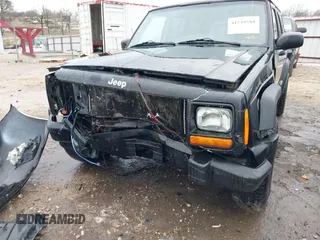 1999 Jeep Cherokee Sport with VIN 1J4FT68S6XL598558, listed as a IAAI auction lot 41549504 with 238,004 mi miles. Bid and sale history available at carsss.com. Image 12.