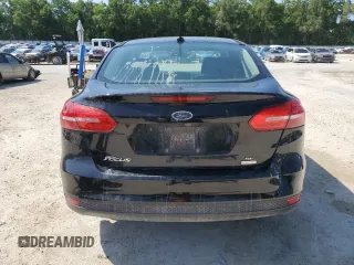 2018 Ford Focus SE z VIN 1FADP3FEXJL256542, wystawiony jako Copart lot #54583915 z przebiegiem 107 774 mil mil oraz Szkoda całkowita • Salvage title. Historia ofert i sprzedaży dostępna na DreamBid. Obrazek 6.