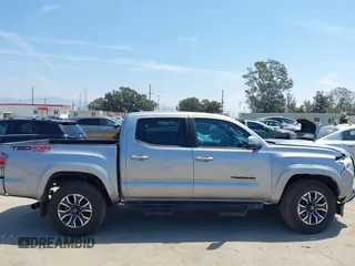 2021 Toyota Tacoma SR with VIN 3TMCZ5AN6MM393306, listed as a IAAI auction lot 42094095 with 57,217 mi miles and . Bid and sale history available at DreamBid. Image 13.