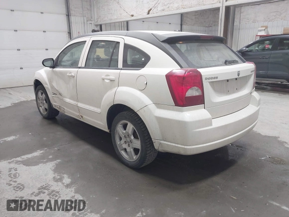 2009 Dodge Caliber SXT with VIN 1B3HB48A19D212690, listed as a IAAI auction lot 42076527 with 212,909 mi miles and . Bid and sale history available at carsss.com. Image 3.