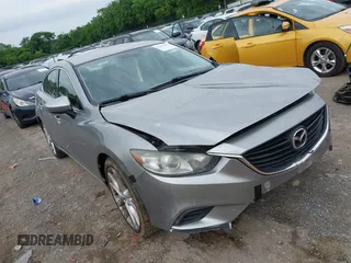 2014 Mazda 6 i Touring with VIN JM1GJ1V55E1102403, listed as a IAAI auction lot 42247657 with 211,386 mi miles and . Bid and sale history available at DreamBid. Image 1.