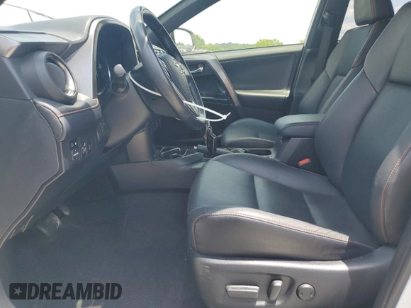 2018 Toyota RAV4 Hybrid SE with VIN JTMJJREVXJD212926, listed as a Copart auction lot 60215465 with 71,876 mi miles and Salvage title. Bid and sale history available at DreamBid. Image 7.