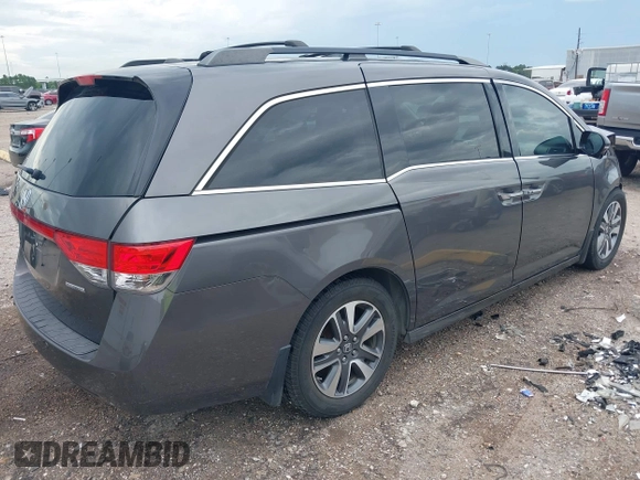 2015 Honda Odyssey Touring Elite with VIN 5FNRL5H99FB089642, listed as a IAAI auction lot 42591786 with 100,755 mi miles and . Bid and sale history available at DreamBid. Image 4.