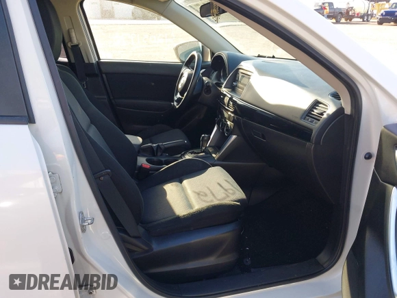 2014 Mazda CX-5 Sport with VIN JM3KE2BE8E0301175, listed as a IAAI auction lot 42051972 with 121,821 mi miles and . Bid and sale history available at carsss.com. Image 5.