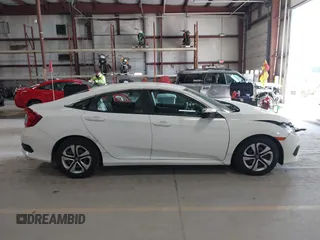 2016 Honda Civic Sedan LX with VIN 19XFC2F59GE028056, listed as a IAAI auction lot 41875940 with 124,243 mi miles. Bid and sale history available at carsss.com. Image 13.