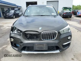 2018 BMW X1 xDrive28i z VIN WBXHT3C33J5F89718, wystawiony jako Copart lot #57726835 z przebiegiem 120 592 mil mil oraz Szkody całkowita. Historia ofert i sprzedaży dostępna na DreamBid. Obrazek 5.