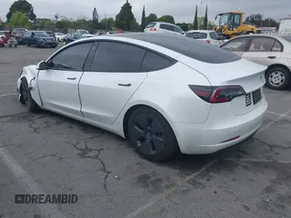 2021 Tesla Model 3 Long Range with VIN 5YJ3E1EB6MF878957, listed as a IAAI auction lot 41915482 with 59,578 mi miles. Bid and sale history available at carsss.com. Image 3.