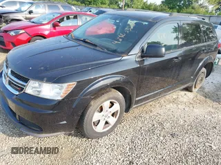 2013 Dodge Journey SE with VIN 3C4PDCAB9DT561701, listed as a IAAI auction lot 42403322 with 143,766 mi miles and . Bid and sale history available at DreamBid. Image 2.