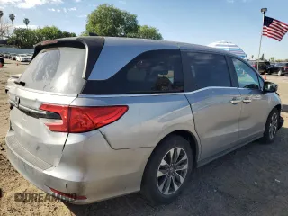 2021 Honda Odyssey EX-L with VIN 5FNRL6H77MB011099, listed as a Copart auction lot 47412535 with 148,004 mi miles and Salvage Title. Bid and sale history available at DreamBid. Image 3.