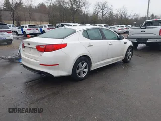 2015 Kia Optima LX with VIN KNAGM4A70F5571034, listed as a IAAI auction lot 41734211 with 214,948 mi miles. Bid and sale history available at carsss.com. Image 4.