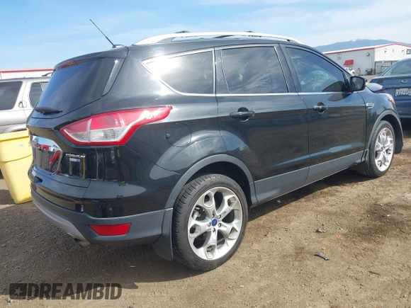 2014 Ford Escape Titanium with VIN 1FMCU9J93EUE27803, listed as a IAAI auction lot 42028249 with 131,194 mi miles and . Bid and sale history available at DreamBid. Image 4.