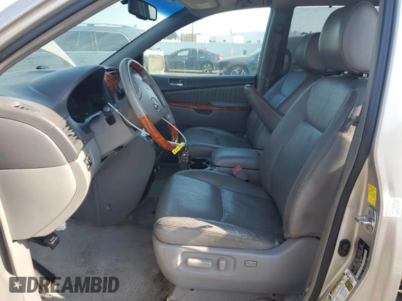 2010 Toyota Sienna XLE with VIN 5TDDK4CC8AS032007, listed as a Copart auction lot 65611495 with 299,904 mi miles and Salvage title. Bid and sale history available at DreamBid. Image 7.