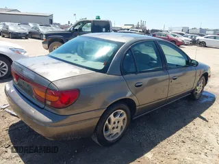 2001 Saturn SL with VIN 1G8ZK52751Z316039, listed as a IAAI auction lot 42035329 with 236,658 mi miles and . Bid and sale history available at DreamBid. Image 4.
