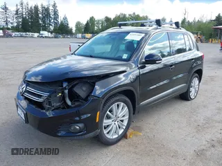 2012 Volkswagen Tiguan SE with VIN WVGBV7AX5CW561368, listed as a IAAI auction lot 42197389 with 63,809 mi miles and . Bid and sale history available at DreamBid. Image 2.
