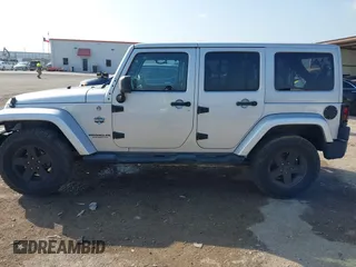 2012 Jeep Wrangler Unlimited Sahara with VIN 1C4HJWEG9CL146750, listed as a IAAI auction lot 41512678 with 94,952 mi miles. Bid and sale history available at carsss.com. Image 14.