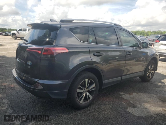 2018 Toyota RAV4 XLE with VIN JTMWFREV5JJ747297, listed as a Copart auction lot 56371505 with 215,598 mi miles and Clean Title. Bid and sale history available at DreamBid. Image 4.