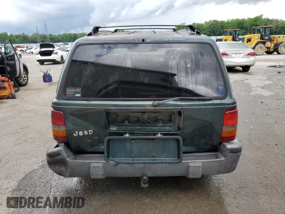 1995 Jeep Grand Cherokee Laredo with VIN 1J4FX58S8SC773884, listed as a Copart auction lot 56572555 with 424,126 mi miles and Salvage title. Bid and sale history available at DreamBid. Image 6.