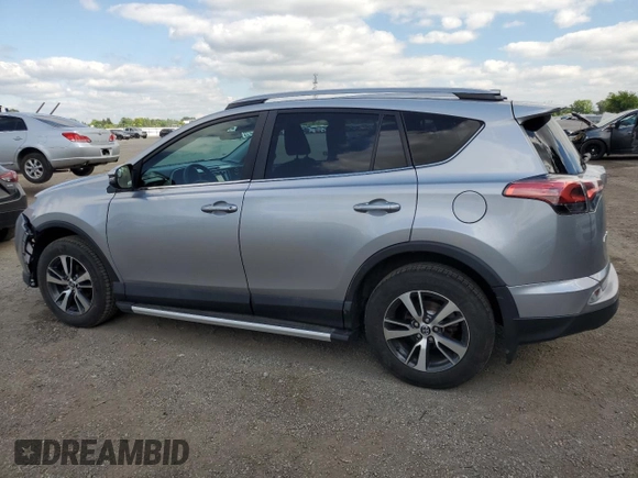 2018 Toyota RAV4 LE with VIN 2T3BFREV8JW788362, listed as a Copart auction lot 64053735 with 124,668 mi miles and Salvage title. Bid and sale history available at DreamBid. Image 2.