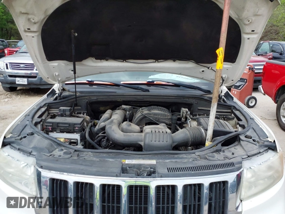 2012 Jeep Grand Cherokee Laredo with VIN 1C4RJFAG8CC124877, listed as a IAAI auction lot 41940603 with 254,356 mi miles. Bid and sale history available at carsss.com. Image 10.