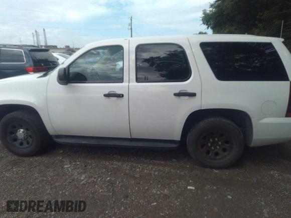 2013 Chevrolet Tahoe Commercial with VIN 1GNLC2E05DR351035, listed as a IAAI auction lot 42641974 with 265,608 mi miles and . Bid and sale history available at DreamBid. Image 14.