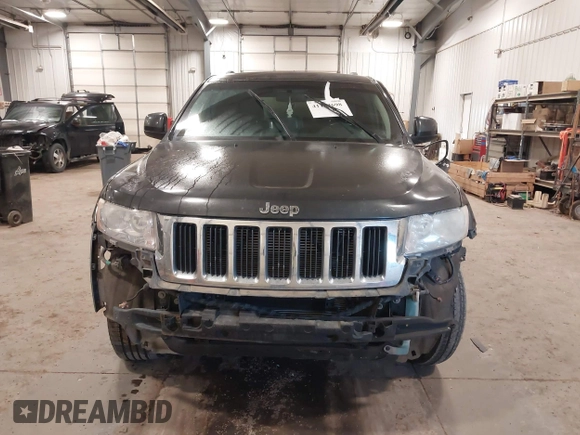 2011 Jeep Grand Cherokee 70th Anniversary with VIN 1J4RR4GG3BC745652, listed as a IAAI auction lot 41133698 with 217,948 mi miles. Bid and sale history available at carsss.com. Image 12.