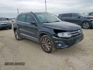 2012 Volkswagen Tiguan SE z VIN WVGAV7AX2CW575871, wystawiony jako Copart lot #58050865 z przebiegiem 96 569 mil mil oraz Szkody całkowita. Historia ofert i sprzedaży dostępna na DreamBid. Obrazek 4.