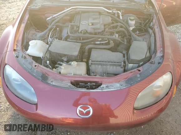 2007 Mazda MX-5 Miata Sport z VIN JM1NC25F970124896, wystawiony jako Copart lot #83624394 z przebiegiem 62 735 mil mil oraz Szkoda całkowita • Salvage title. Historia ofert i sprzedaży dostępna na DreamBid. Obrazek 11.