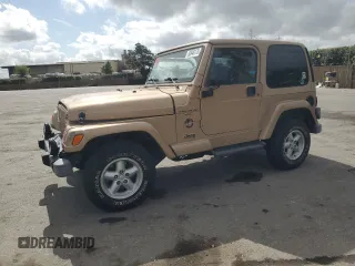 1999 Jeep Wrangler Sahara with VIN 1J4FY49S3XP441051, listed as a Copart auction lot 50946175 with 112,884 mi miles and Salvage Title. Bid and sale history available at carsss.com. Image 1.