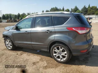 2016 Ford Escape Titanium with VIN 1FMCU9J98GUB32375, listed as a Copart auction lot 59564885 with 123,548 mi miles and Salvage title. Bid and sale history available at DreamBid. Image 2.