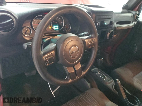 2012 Jeep Wrangler Sport with VIN 1C4AJWAG5CL233049, listed as a Copart auction lot 52328865 with 185,388 mi miles and Salvage title. Bid and sale history available at DreamBid. Image 8.