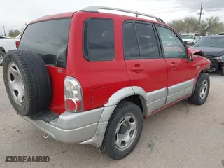 2004 Suzuki Grand Vitara with VIN JS3TE62V344100216, listed as a IAAI auction lot 41734638 with 213,166 mi miles. Bid and sale history available at carsss.com. Image 4.