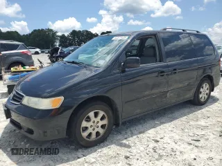 2004 Honda Odyssey EX-L with VIN 5FNRL18944B071796, listed as a Copart auction lot 63371435 with 165,420 mi miles and Salvage title. Bid and sale history available at DreamBid. Image 1.