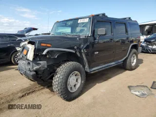 2004 Hummer H2 z VIN 5GRGN23U74H122547, wystawiony jako Copart lot #60100075 z przebiegiem 243 187 mil mil oraz Szkoda całkowita • Salvage title. Historia ofert i sprzedaży dostępna na DreamBid. Obrazek 1.