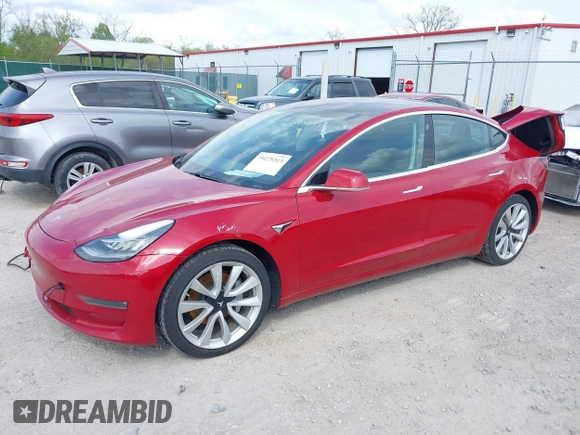 2018 Tesla Model 3 Long Range Battery with VIN 5YJ3E1EA8JF031683, listed as a IAAI auction lot 39275313 with 136,939 mi miles and . Bid and sale history available at DreamBid. Image 2.