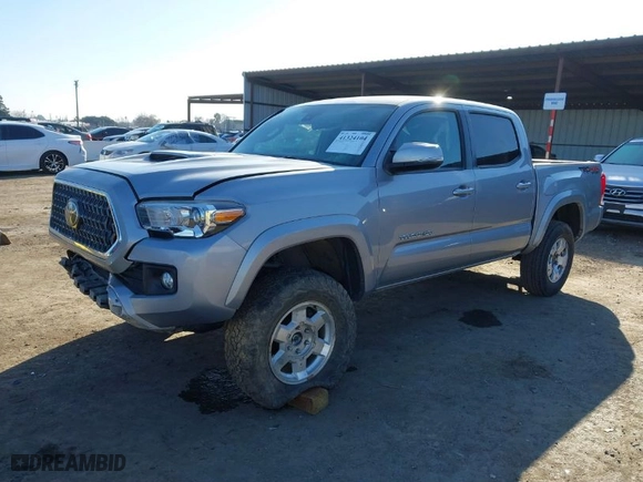 2019 Toyota Tacoma 4WD SR with VIN 3TMCZ5AN4KM194526, listed as a IAAI auction lot 42021504 with 87,767 mi miles. Bid and sale history available at carsss.com. Image 6.